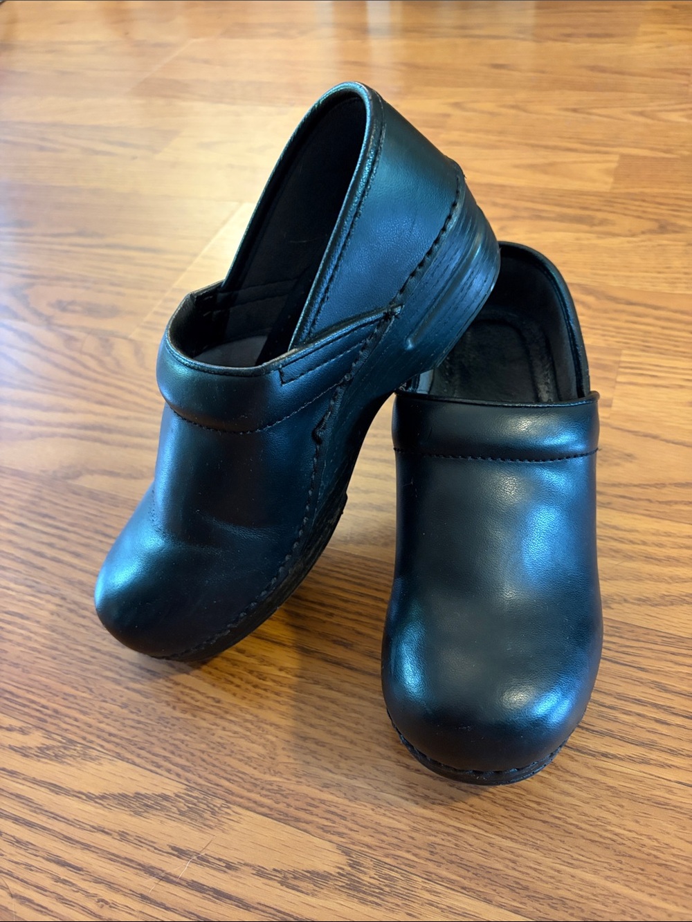 Dansko Black Leather Slip-On Clogs